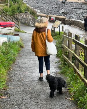 Amanda Lamb Instagram - Despite the vast of the majority of the country having sunshine, it’s raining in Devon… old me would’ve stayed indoors and probably been through a bottle of red by now..
This new version has just emerged from the sea in the pouring rain and it felt amazing… I even convinced the legend that is @ruthrubythursday66 to join me… never once have I regretted a swim… how’s the sunshine everyone?