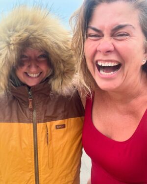Amanda Lamb Instagram - Despite the vast of the majority of the country having sunshine, it’s raining in Devon… old me would’ve stayed indoors and probably been through a bottle of red by now..
This new version has just emerged from the sea in the pouring rain and it felt amazing… I even convinced the legend that is @ruthrubythursday66 to join me… never once have I regretted a swim… how’s the sunshine everyone?