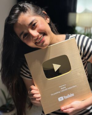 Aurra Bhatnagar Badoni Instagram - We made it 🥹🫶🏻✨ 
Gold gold gold got gold from none other than @youtube I want to take a moment to realise how far we have come today like 1 MILLION SUBSCRIBERS MY GODDD I can’t believe it till I got this beauty n now holding this beauteous in my hands is surreal 🥹 thank u so much it wouldn’t have happened if u guys were not there thank u so much love ya my @youtube fam ❤️✨ n thank u mum the real women behind everything by managing my all social platforms n being my camera man,fashion designer n what not @deeptibhatnagarbadoni <3 🫶🏻✨🥹

~ love Aurra 🤍✨🫶🏻