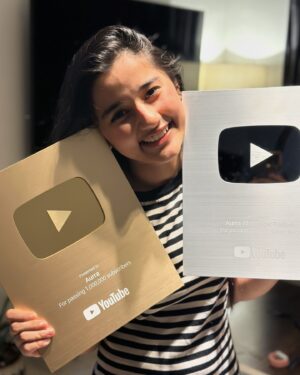 Aurra Bhatnagar Badoni Instagram - We made it 🥹🫶🏻✨ 
Gold gold gold got gold from none other than @youtube I want to take a moment to realise how far we have come today like 1 MILLION SUBSCRIBERS MY GODDD I can’t believe it till I got this beauty n now holding this beauteous in my hands is surreal 🥹 thank u so much it wouldn’t have happened if u guys were not there thank u so much love ya my @youtube fam ❤️✨ n thank u mum the real women behind everything by managing my all social platforms n being my camera man,fashion designer n what not @deeptibhatnagarbadoni <3 🫶🏻✨🥹

~ love Aurra 🤍✨🫶🏻