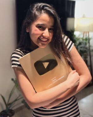 Aurra Bhatnagar Badoni Instagram - We made it 🥹🫶🏻✨ 
Gold gold gold got gold from none other than @youtube I want to take a moment to realise how far we have come today like 1 MILLION SUBSCRIBERS MY GODDD I can’t believe it till I got this beauty n now holding this beauteous in my hands is surreal 🥹 thank u so much it wouldn’t have happened if u guys were not there thank u so much love ya my @youtube fam ❤️✨ n thank u mum the real women behind everything by managing my all social platforms n being my camera man,fashion designer n what not @deeptibhatnagarbadoni <3 🫶🏻✨🥹

~ love Aurra 🤍✨🫶🏻