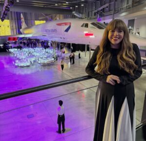 Briony May Williams Instagram - Absolutely dreamy evening at the @bbcbristol Make a Difference Awards ❤️ Hearing all the incredible stories of the nominees and winners is so good for the soul. These people are selfless, kind and inspiring in every way, truly making a difference to the world around them. 

The evening was made even more magical because it was spent under the wings of a Concorde at @aerospacebristol 🤩 What an experience!!! 

It was wonderful to catch up with all the amazing people who work at @bbcbristol and put the awards together and of course @joesims10 and Claire Carter were excellent hosts ❤️ 

My highlights included in no particular order:

* Bumping into my babe @eviemaeaestheics 
* Seeing the fabulous @charlie_bees_1989 and meeting her lush mum Deb
* Walking through an actual Concorde 
* Presenting the Great Neighbour Award
* Sitting next to a 5 month old puppy wearing a bow tie all evening (Oren is a service dog in training and was so well behaved all night!)
* Cheering on Chloe and @watchochogrow when they won
# Wearing the dress I ordered on TikTok months ago in the middle of the night

#makeadifference #bbc #bristol #bbcradiobristol