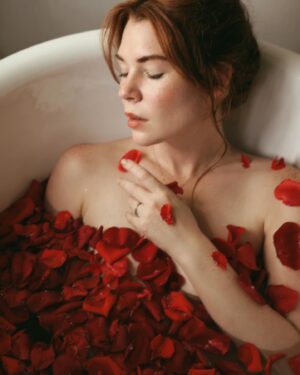 Courtney Halverson Instagram - I am nothing if not a hopeless romantic. Forever searching for the songs and books and movies and poems that make my heart swell and nearly break each time, before gently mending itself again and again. 🥀 and chances are if you’ve ended up on my little corner of the internet, you feel the same. 

So here’s to us who play the saddest songs and languish in the bath and feel all the feelings. We’re just hopeless romantics. 

ps : if you have a song to contribute to my ‘sad girl bath tunes’ playlist please let me know, I’m always looking to grow it. 📻 🥀 
.
.
.
#romanticstyle #vintagevibes #elegantstyle #redrosepetals #hopelessromantic