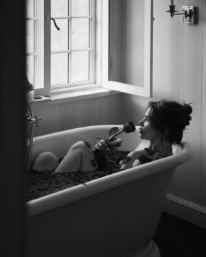 Courtney Halverson Instagram - I am nothing if not a hopeless romantic. Forever searching for the songs and books and movies and poems that make my heart swell and nearly break each time, before gently mending itself again and again. 🥀 and chances are if you’ve ended up on my little corner of the internet, you feel the same. 

So here’s to us who play the saddest songs and languish in the bath and feel all the feelings. We’re just hopeless romantics. 

ps : if you have a song to contribute to my ‘sad girl bath tunes’ playlist please let me know, I’m always looking to grow it. 📻 🥀 
.
.
.
#romanticstyle #vintagevibes #elegantstyle #redrosepetals #hopelessromantic