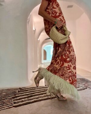 Janet Gunn Instagram - This dress by @ladoublej was my favorite, I think it was the whimsical movement of the fabric and definitely the feathers. It also looks great with sandals. 
Founder JJ Martin’s fabrics are made in Italy and she definitely captured the “spirit italiano”  and elevated energy for dressing! 
#ciaobella 
#ladoublej #italianfabrics #italianstyle #petitefashion #thesisterhood #sardinia #lifeisyourrunway #madeinitaly