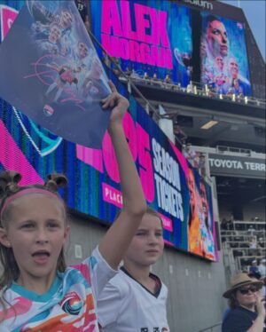 Kara Keough Instagram - Alex,
I don’t know crap about soccer, but watching you play the last 17 years has felt a lot like witnessing a hero’s journey. I’ve cheered along as you’ve taken on the gauntlet that has been your life and earned genuine respect from a wider and wider circle, until the whole world couldn’t help but tip their cap to you. A salute to a trailblazer who does so much for sports, for women, for girls, but also for her friends and family. Being really really really really good at soccer is only the 70th best thing about you, but last night, as you walked off the pitch, I looked around at a stadium full of crying and smiling little girls. I watched moms and dads hugging their daughters, reassuring them - “It’s okay, it’s gonna be okay.” And they’re right. Because of you and all that you’ve done on and off the field, it IS gonna be okay. So while a stadium full of little dreamers saw their hero hang up her boots last night, they’ll soon see that this doesn’t mean you’ve taken off your cape. Can’t wait to see what you do next, Al.