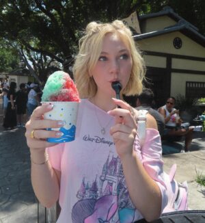 Lily Brooks O'Briant Instagram - Moments in Florida ✨
1. beach days are the best days 
2. the best shaved ice I’ve ever had omg 
3. Rawr 🦁 
4. soooo… the Harry Potter ride caught on fire while we were riding it and the fire alarm started going off & the lights turned on but the ride kept going 💀
5. Prettiest sunset from the plane 🌅
6. Emma’s face omg 
7. I never wanna leave 🏝️
8. when u & your long distance bestie reunite>>
9. EPCOT BALL 😍
10. best nap of my life omg
11. my lifelong dream of being the can can dancer at Hoop Dee Do Revue finally came true
12. animal kingdom 🍃
13. selfieee
14. more beach picsss
15. my fave ride in EPCOT
16. airport fit check ✌🏻