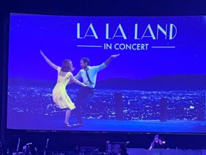 Nia Vardalos Instagram - Tonight is the final night! A perk of living in LA is LA LA LAND in concert with the gentle genius #academyaward winning composer #justinhurwitz and the original recording musicians! Conducted by Justin (in the pic with me whee), they played the score while we watched the film, it was magic. 🪄 ⭐️ Tickets for tonight and many more fabulous upcoming events are by the extraordinary folks at: @stfoodcinema  #notanadjustafan