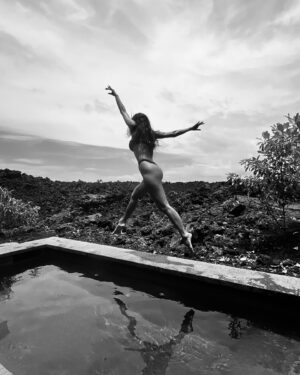 Nicole Scherzinger Instagram - Seated on ancient lava, I connect with the roots of my ancestors—embracing a legacy etched in volcanic stone and timeless heritage. 🌋
