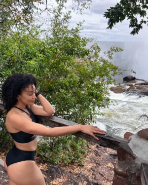 Pearl Thusi Instagram - My version of TLC is chasing water falls … 🌊
Waterfall rain hits different… the drip is crazy!

PS. Hope to have another adventure with you @chlomoolala 🤞🏽🤍

Would you love to visit Victoria falls?