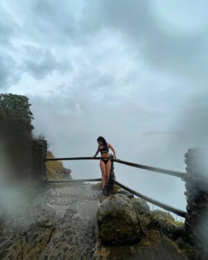 Pearl Thusi Instagram - My version of TLC is chasing water falls … 🌊
Waterfall rain hits different… the drip is crazy!

PS. Hope to have another adventure with you @chlomoolala 🤞🏽🤍

Would you love to visit Victoria falls?
