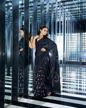 Rasika Dugal Instagram - 🖤♠️ 
#MirzapurS3Promotions #MirzapurS3

Saree: @injiri 
Jewellery: @shopziddi 
MUA: @mayura_makeup_hair 
Hairstyling: @vithikajaiswal 
Styling: @who_wore_what_when 
📸: @chandrahas_prabhu
📍: @fsmumbai 

This beautiful sari from #Injiri is a fascinating example of craftsmanship that beautifully combines two of my favourite Indian textile traditions: Chikankari from Lucknow and Bandhani from Gujarat. Chikankari is an intricate form of hand embroidery celebrated for the craftsmanship involved, often passed down through generations of artisans. Bandhani is a tie-dye technique which requires a high level of expertise to achieve uniformity in the patterns. To skill, precision and all things detailed! ❤️