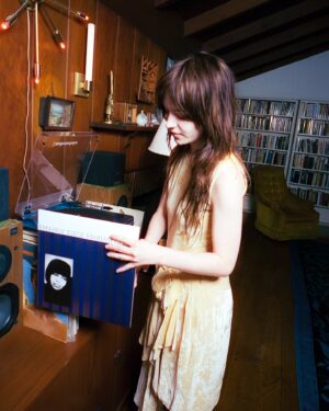 Sophie Thatcher Instagram - Really excited about this brand new series - the Favorite Records Series!

First to take part is the incredible musician and actress, Sophie Thatcher.

For this series, artists list 10-15 of their favorite records. Rules are at least one album needs to contain a synth or drum machine of some kind.

Sophie picked some gone ones, on the site now. 🎶

Photos by @ambarbecutie
Editor-in-chief @danz_cm
Lighting Assist: @max_flick
Styling by: @lindseyhartman 

Here’s an excerpt:

[Peter Ivers - Becoming Peter Ivers
A friend of mine showed me the original “In Heaven” song recorded by him and I was floored. I went deep into his lure and watched all of the New Wave Theatre videos. He has an earnestness and charm to his songs. I immediately felt nostalgic hearing this record for the first time. 

Flaming Tunes - Flaming Tunes
This album is a huge influence on my own music. The beats in this album are huge inspiration. It all feels very organic and visceral. The album feels very haunted and like a world I feel comfortable in. 

Kleenex -liliput
I was listening to this album a lot for the first season of Yellowjackets. I imagined Natalie would’ve loved this band and used pictures of the band members for reference to the costume designer. This album is my go to “get hyped” music or if I need a pick me up.

Sparklehorse- Vivadixiesubmarinetransmissionplot
“Weird Sisters” is one of my favorite songs ever. I grew up on this album so it holds a very special place in my heart. Every song on it is a masterpiece. I love you Mark Linkous. 

Tall Dwarfs - Fork Songs
The song The Slide off this album is also one of my favorite songs. It’s so sexy and melancholy. Something about New Zealand 90s indie hits different. Anything Flying Nun I’m all here for. I think this is the third band I’ve listed off Flying Nun, so there you go. ]

Exclusive.
