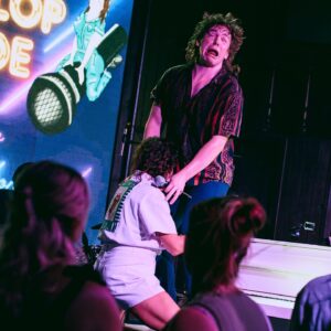 Steph Tolev Instagram - SLIP, SLOP & SLIDE absolutely SLAPPED!! Can’t explain how much fun we had on stage and guess what this will be happening AGAIN!! Thank you @sarahrosephoto__ for capturing this magical night and @longtimenoseecomedy for putting this on 🥰🥰🥰