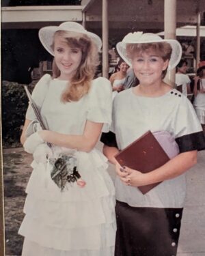 Wendi McLendon-Covey Instagram - My 9th grade graduation day, next to one of my lifetime bestie Stacey Mercurio, who was only in the 8th grade at the time. Those hats were all the rage that year, and I believe we purchased ours from Windsor Fashions! Anyway, Stacey's 54th birthday is this weekend.... Weirdly enough, she looks exactly the same! I don't know how she does it!