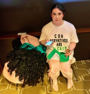 Charlie Craggs Instagram - Made an iconic slogan tshirt, put 3 wigs on my head and travelled 2 hours into London to leave the @wickedmovie premiere within 5 MINS because I fell down the stairs (!) and broke my heel (!!) and left before the film even started (!!!) in the most expensive cab of my life all the way back to the countryside (!!!!) because even though I am a basic white girl I refuse to go barefoot in public (!!!!!) but I kinda had to because I had to leave the event shoeless and wigless via the red carpet with all the fans watching (!!!!!!) and wait for my cab barefoot in the rain so now I probably have trenchfoot (!!!!!!!) @arianagrande / @cynthiaerivo can one of you lend me £89.80 (plus tip) please 😔 Thanks for having me (for 5 mins) @universalpicturesuk & @charnleycommunications I heard the films really good #wicked #trenchfoot