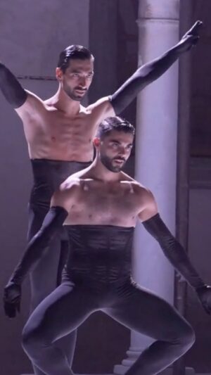Drew Jacoby Instagram - Evening entirely curated by @balletrusse  presents “Waltz”
Choreography: Drew Jacoby
Dancers: Thomas Martino, Daniel Domenech
@drewjacoby @thomasmartino__  @danieldomenech_____ Waltz, by Drew Jacoby is packed with power, abstract beauty, and masterly executed physical virtuosity. The two dancers sculpt themselves sharply into a riveting, pulsating, and technically challenging scene. Jacoby creates a visually striking abstract dance that compels the viewer to be transported into the world of the two men…an intense and intimate work layered with strength, wit, and sensuality. @dap_festival #costumedesign @sonya__costumes