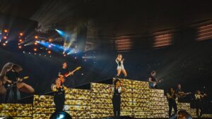 Eliotte Woodford Instagram - It’s still settling in that The Eras Tour is done. I’ve noticed that all of us involved are still going through the wave of emotions and trying to process it all. It’s evidence of how deeply this affected all of us and it will probably take a long time to wrap our heads around it. A 2 year journey that has permanently marked each of us. 

This post is *long* but it’s to say how GRATEFUL I am to know these people. 
Some NEW, some OLD, all FAMILY. 
@taylorswift you caught lightning in a bottle with this group. Thank you for bringing all of us together to be a part of the most epic experience for a performer, musician, human. I am humbled to say I got to share the stage with these superheroes and got to create memories and ridiculous belly laughs on and off stage. The fact that we are all a family comes from who you are and the way you lead with such genuine intention and generosity. 

My bandmates and Starlights - I don’t have words to express my love for each of you. This tour has brought us closer together, more than our previous tours, in such a way that I know we are truly bonded for life. Our love is deep, mature, honest, and silly. I couldn’t ask for better. There was a lot of “life” that happened while we were on this tour, and it was incredible to see how we were there for each other in both hard and celebratory times. 
@smalltown1 @maxephronbernstein @melanienyema @gypsymoonshine - thanks for leading us on the road and keeping this show TIGHT. 
I love our commitment to excellence. 149 shows of 3.5  hours of live music. Wow. We did it!

@davidcook88 - THANK YOU for leading this band to musical perfection and truly caring about the quality of each of us as humans and musicians. Your arrangements made this epic live show FEEL like an epic live show. I am honored to have been under your leadership all these years. Thank you for helping me grow in so many aspects of my life. 

***CONTINUED IN COMMENTS***