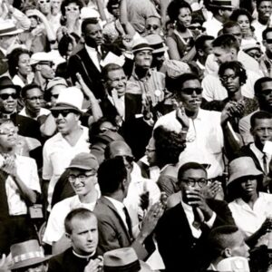 Isabel Wilkerson Instagram - Earlier this year, out of the blue, I received a most unusual query about the cover of Caste — and its landmark photo of hundreds of real-life people from all walks of life. 
A woman in California, Linda Sokolnicki, reached out wanting to know where the photo was taken because she saw her father’s face in it. 
The photo shows some of the quarter million people gathered at the 1963 March on Washington where MLK delivered his “I Have a Dream” speech.
I asked her which man was her father, and she sent me an image of the book with a circle around a man with a heart-shaped face in a priest’s collar.  She said her father, Gene Curry, was a retired Episcopal priest in Michigan, a gentle and humble man who was up in years now at 88 and that his health and memory were not what they once were. 

The discovery began with his wife, Ruth. 

A friend of hers, a principal, had told her that “if I only read one book this year, this is the one I should select.” So Ruth ordered Caste. “When I got it, I saw Gene‘s picture on the cover. That is how it all started.” 
Rev. Curry sent a group text to his children about being on the cover. The daughter ordered the book and immediately spotted him. Her husband happened to hear an interview of mine and told her, “I just heard this interview, and I’m thinking about getting this book called Caste.” 
Linda said, “That’s the book I was telling you about with my Dad on the cover!”
Gene Curry, born in 1936, worked as an engineer and served as a priest at a church in Detroit, whose rectory doors were always open to the poor. When the first black residents moved to their block, the Curry family befriended them while other whites fled. During Covid, he placed blessed ashes on the foreheads of motorists in a snowstorm at Lent.
The discovery was a gorgeously full circle moment. Had the photo not wrapped around the back of the book and been positioned just so, his face would not have been visible. Had his wife not ordered the hardcover, they would never have seen his face — it was cropped out of the smaller-sized paperback. 
This is the time of year to honor miracles, and the things that are meant to be.