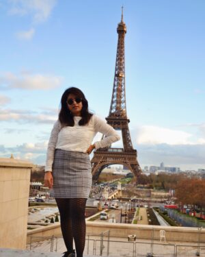 Mithra Kasthurirangan Instagram - Photoshoot that manifested 🤩 In front of the Eiffel Tower. Truly surreal! Making it to the city of love, hot chocolate, croissants, and fashion 🖤 Though Paris has its own dark side, this shoot was a dream come true—a gift to myself I’ll always cherish.

Ootd details 
Skirt - @hm 
Top - @styleunion.in 
Shoes - @aldo_shoes 
Parka - @zara 
Stockings - From airport duty free