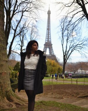 Mithra Kasthurirangan Instagram - Photoshoot that manifested 🤩 In front of the Eiffel Tower. Truly surreal! Making it to the city of love, hot chocolate, croissants, and fashion 🖤 Though Paris has its own dark side, this shoot was a dream come true—a gift to myself I’ll always cherish.

Ootd details 
Skirt - @hm 
Top - @styleunion.in 
Shoes - @aldo_shoes 
Parka - @zara 
Stockings - From airport duty free