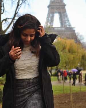 Mithra Kasthurirangan Instagram - Photoshoot that manifested 🤩 In front of the Eiffel Tower. Truly surreal! Making it to the city of love, hot chocolate, croissants, and fashion 🖤 Though Paris has its own dark side, this shoot was a dream come true—a gift to myself I’ll always cherish.

Ootd details 
Skirt - @hm 
Top - @styleunion.in 
Shoes - @aldo_shoes 
Parka - @zara 
Stockings - From airport duty free