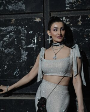Shalini Passi Instagram - Crosses or swans? What do you like the most?🩶🩶

Personal wardrobe 🩶🩶

Outfit -  Itrh by Mohit Rai (@itrhofficial, @mohitrai) @itrh_ridhibansal
Jewelry- Dolce & Gabbana (@dolcegabbana)
Bag- Judith Leiber India (@judithleiberindia) 
Bag Name- Poodle, Swarn
Heels: @valentino
Styling Team: @mohitrai, @ayeshaaminnigam, 
@madhurisinghhhh
Beauty Team: Raveena, @raj_mukadam, 
Photographer Viraj Joshi (@virajjoshiii)
Personal shopper- @roshnisukhlecha