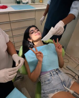 Alisha Chopra Instagram - I’ve been getting my aligners treatment from @signaturesmilesmumbai using @illusion_aligners because this girl decided not to wear her retainers in school after her braces (:

But can you even notice in which pictures I’m wearing the aligners and in which I’m not? 
its been nothing but a smoooth ride, I can’t even begin with how hygienic and satisfactory my experience with @signaturesmilesmumbai has been. 
@docsanshine docsanshine is my dentist, and she’s the kindest. Extremely warm, patient - She’s made it as comfortable as a dental experience can be! 😹♥️
I’m on the last leg of my treatment now, my buttons will be removed soon - and I’ll have perfectly aligned, no buck teeth teeth once again hehe, so excited. & you honestly can’t even see @illusion_aligners , and they’re prettty precise! I’ve even been shooting in them🪥
.
.
.
#dentist #dental #aligners #teeth #perfectteeth #illusionaligners #signaturessmiles #mumbai #treatment #smile