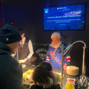 Anne Burrell Instagram - Soooooooo HIIIIIIIIIIIII everyone and Happy New Year!!! It’s been a minute since I have posted but I’m back!! An absolutely TREMENDOUS night last night @thegarden cheering on MY @nyrangers for a win and hanging out in the Delta Lounge and serving my Steak Pizzaiola Hero !! It was YUMMY!!! Getting to go on the ice was a HUUUUUGE highlight too!!! Oh what a night!!!! #theclaxtons #ilovewhatido #luckygirl