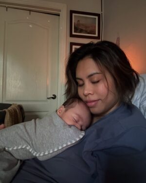 Ashley Argota Instagram - 2024. What a year. There have been so many highlights this year. But here’s what it really looked like. :) My pregnancy was so hard. I was so sick all the time and the meds I took to help with it made me tired. I threw up so hard sometimes that I blew blood vessels in my eyes. Actually giving birth to Michael might have been the easiest part of it all 😂 we wrote our second screenplay during this pregnancy and I’ve spent the first months of Michael’s life producing and getting ready to act in it. I’ve had a goal since I was 15 to be working on a set at least once a year. This is the first year I haven’t achieved that goal. That’s been hard. Feeding my son has been amazing. But pumping and feeding have also been hard on my body. And my god the body changes!! It has been difficult to look and feel like myself. I am still trying to find it. 

But so many good things also happened. We are making our first Mismo movie. That’s been so exciting. Watching our son discover the world has made my heart burst every day. And watching the love of my life become a father has been the greatest gift. This year was hard but my goodness it was fulfilling and amazing in so many ways. I’ll find myself again eventually. In the meantime, I’ll be over here working hard AF while also snuggling my boys and my sweet pup. Thank you, 2024. 🖤

Also side note if you’ve made it this far— as a member of the itty bitty titty committee I have spent this year learning what it’s like to have boobs! Omg!!!!!! What a difference!!!! Lolololol