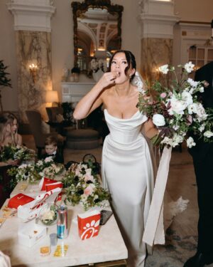 Blair Fowler Instagram - We got our wedding photos and film footage back from the best day of our lives!!! There’s so much I haven’t shared yet because I was waiting on the footage but get ready. I’m furiously editing now, but to get us started on this overshare, enjoy one of my favorite memories from the day - @alexalosey coming in clutch with the chick fil a 😏

📸Photography and Film: @4everstudiostexas 
🏩Venue: @hermitagehotel 
💐Florist: @echoesofedenflorals with @froufrouchic ribbons 
👗Dress: @viviennewestwood from @ilabridal 
👡Shoes: @loefflerrandall 
👰🏻‍♀️Veil: @alice_and_mae 
📱Vertical content: @thevowedsocialco