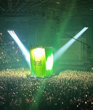 Camila Mendes Instagram - thanks for letting me relive my high school rave girl era 💚 @spotify @charli_xcx @troyesivan