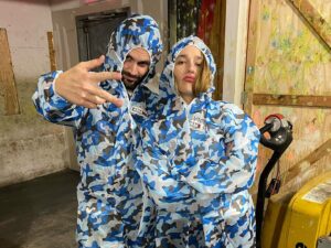 Jemima Kirke Instagram - Friday night paint balling with my brother in law @pennbadgley who couldn’t stop doing this in the pics. I got hit on my pinkie knuckle and he got fatigued after one round. So we sat out the rest of the game, eating the kids pizza crusts, talking about podcasts.