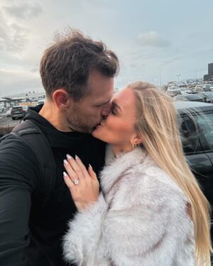 Katrin Tanja Davidsdottir Instagram - OUR ENGAGEMENT STORY & our week of ✨BLISS✨ sharing it with out closest people 💖☁️💫🥰 I don’t even know where to start but @brookslaich actually proposed in Iceland & he COMPLETELY surprised me! 

We had decided to do christmas & new years at home in Coeur D’Alene this year so I decided to squeeeeeze in a trip back home to Iceland to see my family, best friends, the christmas lights, have hot chocolate & whipped cream ❤️🎄🥹✨ ya know just all my christmas favorites!!! 

I ALSO decided to make a quick trip to London for the weekend to see my family there (little did I know I was planning my own engagement right there when I decided to book that trip🤣)

I was suppose to land in Iceland at midnight on that sunday but after some delays I wasn’t leaving the airport until 1am & I was so tired. I called Brooks literally just to chat to stay awake because the drive is an hour (the whole time we were chatting I am thinking he is in states!!!!!) and as I get into parking garage I tell him I love him & say good night. 

But when I opened our apartment door there he was, standing in the middle of our living room, surrounded by roses & candles & flower pedals & I just FROZE 😭✨ I was so shocked & so happy & literally my dream is coming true all at same time so I actually just froze and said nothing and didn’t even move for probably a good 30 seconds 🤣

But it was the most beautiful moment at 2am ❤️ After he proposed we just wanted to sit in the moment for longer, so I made us hot chocolate & whipped cream & we sat down on the couch together. I asked him to tell me EVERYTHING from the planning to the ring & we chatted until about 5am that morning!!

It was the most thoughtful proposal & perfectly us ❤️🌹 He did it in Iceland to honor that that too is our home (🥹), to also make memories there & so that we could share the news in person with our family & best friends there. And that week at home after was just that: THE MOST SPECIAL 💫☁️💖 

I have just been up there swirling on a pink cloud and not sure I will ever come back down to earth actually 💍🤭 the happiest I have ever been & so excited to start this next chapter of life with my future HUSBAND!!!!! @brookslaich