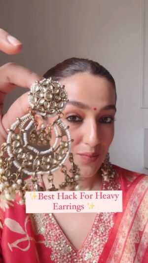 Kiwi Tandon Instagram - Save this coz we all need this 🤪

Simply apply a numbing cream to your ears and leave it on for few minutes. 
Then, place a small band aid  behind your earlobe as support. Now, when you put on your earrings, they’ll feel much more comfortable, and your ears won’t hurt!

My chaandbalis are not very heavy but still I use this hack on every earrings so that I feel comfortable. 
Try and send this to the one who really need this 😀

(Festivals , earrings hack, heavy earrings hack, navratri look, Diwali look, festive outfits, festive look, festive makeup) 
#earringshack #festivemakeup #festiveoutfits #kurtasets #myntrafinds #myntrahaul #indianwear #indianoutfits #indianweddingstyle #indianweddings #outfitinspirations #browngirls #browngirlmakeup #grwm #fashionhacks #hacks #lifehacks #beautyhacks #makeuphacks #chaandbaali #earringshaul #jhumkas #jewelleryhaul #indianjewellery #ethnicwearonline #fashionreels #indianfashionblog #karwachauthlook