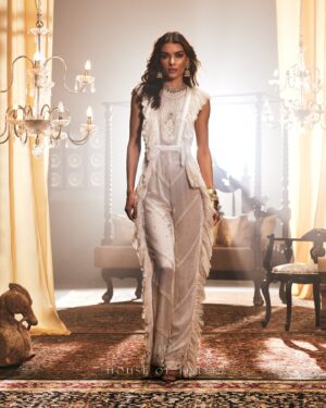 Krithika Babu Instagram - Where artistry meets elegance.

The Aadhira Jumpsuit is a masterpiece, woven with the finest chikan kari embroidery, crush chiffon, and lace embellishments. 

The Indira Trousers, with their impeccable tailoring and flattering rise, combine seamlessly with the Tara Top—a statement of sophistication with its embroidered lace, beadwork, and delicate laser-cut details.

A tribute to the discerning woman who embraces the finer things in life.

Experience the collection at www.houseofthreestudio.com or visit our flagship store on Vittal Mallya Road, Bangalore.

Models @rodriguessolive @krithikababu

Photographer @abinvrghz

Stylist @queenandro_

Jewellery @bhimagold.official

Carpets @carpetkingdomindia

Creative direction @sounaksenbarat
@anushyamsundar
@houseofthreestudio

Decor @houseofthreeinteriors
Produced by @nevrmint.productions
.
#aratrikacollection #houseofthree #fashion #couture #designers #design #bangalorefashion #fashionartistry #couturefashion #bangaloredesigners