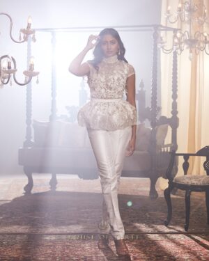 Krithika Babu Instagram - Where artistry meets elegance.

The Aadhira Jumpsuit is a masterpiece, woven with the finest chikan kari embroidery, crush chiffon, and lace embellishments. 

The Indira Trousers, with their impeccable tailoring and flattering rise, combine seamlessly with the Tara Top—a statement of sophistication with its embroidered lace, beadwork, and delicate laser-cut details.

A tribute to the discerning woman who embraces the finer things in life.

Experience the collection at www.houseofthreestudio.com or visit our flagship store on Vittal Mallya Road, Bangalore.

Models @rodriguessolive @krithikababu

Photographer @abinvrghz

Stylist @queenandro_

Jewellery @bhimagold.official

Carpets @carpetkingdomindia

Creative direction @sounaksenbarat
@anushyamsundar
@houseofthreestudio

Decor @houseofthreeinteriors
Produced by @nevrmint.productions
.
#aratrikacollection #houseofthree #fashion #couture #designers #design #bangalorefashion #fashionartistry #couturefashion #bangaloredesigners