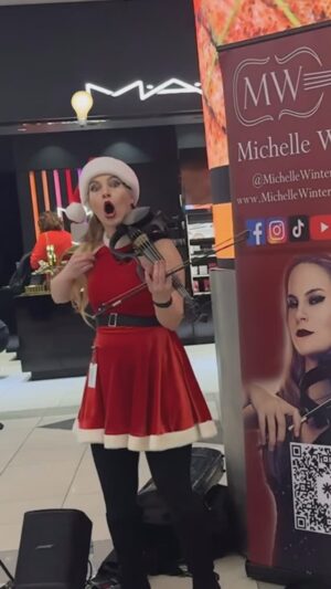 Lindsey Stirling Instagram - This moment totally made my Christmas Eve!! @michellewintersofficial was bringing so much joy to the Atlanta airport.