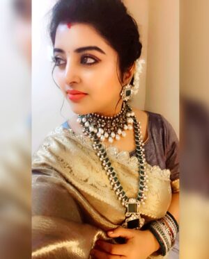 Mahalakshmi Shankar Instagram - The saree from @raagaclothing features a rich golden sheen, giving it a luxurious and festive appeal.The intricate lace border adds a delicate touch of sophistication.This tissue fabric  have a soft and smooth texture, enhancing its overall grandeur which is Perfect for traditional events, weddings, or special occasions.

The layered necklace with emerald-green and white stones from @chennai_jazz stands out beautifully, complementing the golden saree. The choker necklace with pearls adds a regal touch, making the ensemble more opulent. Matching earrings and bangles tie the whole look together seamlessly. The jewelry enhances the ethnic appeal and highlights the overall attire.

Blouse designed and stitched by @lakshmi_lv14