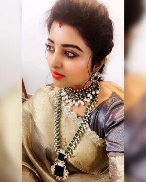Mahalakshmi Shankar Instagram - The saree from @raagaclothing features a rich golden sheen, giving it a luxurious and festive appeal.The intricate lace border adds a delicate touch of sophistication.This tissue fabric  have a soft and smooth texture, enhancing its overall grandeur which is Perfect for traditional events, weddings, or special occasions.

The layered necklace with emerald-green and white stones from @chennai_jazz stands out beautifully, complementing the golden saree. The choker necklace with pearls adds a regal touch, making the ensemble more opulent. Matching earrings and bangles tie the whole look together seamlessly. The jewelry enhances the ethnic appeal and highlights the overall attire.

Blouse designed and stitched by @lakshmi_lv14