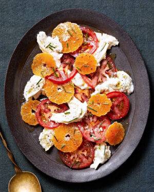 Martha Stewart Instagram - Who doesn't love a caprese salad? Rethink the salad for winter by adding juicy citrus to the mix to create a new colorful splash. The fruit really wakes up the tomatoes and mozzarella with a pop of sweetness. Get the recipe at the link in our bio. 📷: @chrisrsimpson recipe: @lucullanfoods food styling: @laurarege prop styling: @suzie_myers