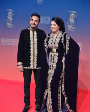 Mounia Lamkimel Instagram - @marrakechfilmfestival 
مع العمر @naamanadil 

حطيت الالبوم لي وصلني كااامل حيث ماعرفتش شنو نختار🫣 شكرا بزاااااف @tendancevision 
بغيت نقول شكرا لادارة المهرجان على حفاوة الاستقبال شكراً للاعلام المغربي على التتبع والمساندة 🇲🇦♥️
شكرا العزيزة الغالية @zor.creations  على اللبسة الهماوية لي تمتعت وانا لابساها ورغم الظروف الصحية والانشغالات إلا انك كنتي متمكنة من حرفتك ولبستيني أنا وعادل على أكمل وجه
شكرا من القلب اخويا وصديقي المتميز @halim_barakat_official لي ماكنتيق إلا فيه ولي شرف على الماكياج والشعر فوقت خرااافي وعطى نتيجة حبييييييتها😌♥️