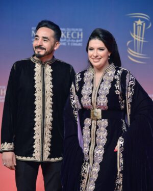 Mounia Lamkimel Instagram - @marrakechfilmfestival 
مع العمر @naamanadil 

حطيت الالبوم لي وصلني كااامل حيث ماعرفتش شنو نختار🫣 شكرا بزاااااف @tendancevision 
بغيت نقول شكرا لادارة المهرجان على حفاوة الاستقبال شكراً للاعلام المغربي على التتبع والمساندة 🇲🇦♥️
شكرا العزيزة الغالية @zor.creations  على اللبسة الهماوية لي تمتعت وانا لابساها ورغم الظروف الصحية والانشغالات إلا انك كنتي متمكنة من حرفتك ولبستيني أنا وعادل على أكمل وجه
شكرا من القلب اخويا وصديقي المتميز @halim_barakat_official لي ماكنتيق إلا فيه ولي شرف على الماكياج والشعر فوقت خرااافي وعطى نتيجة حبييييييتها😌♥️
