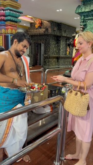 Nazanin Amiri Instagram - Blessing by Pujari. (The person who works in Hindu temples and is responsible for religious duties is typically called a “Pujari.” A Pujari performs rituals, conducts prayers, and takes care of the temple’s religious services and offerings. They also guide worshippers and help maintain the temple.)(The ash that a Pujari (priest) in Hindu temples uses is typically called **Bhasma**. It is sacred ash, usually made from the burning of holy substances like specific wood or plants, and is an important part of religious rituals.
Bhasma is often applied on the foreheads of devotees as a symbol of purification, humility, and connection with the divine. In many Hindu temples, the ash represents the impermanence of life, reminding worshippers of both death and renewal. It is kept in special containers and used regularly in temple ceremonies.) Location:Buta Cave in Malaysia 🇲🇾 
@nazaninamiri_official 
#temple #hindu #malaysia #travelgram