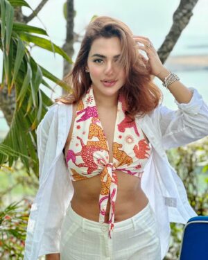 Nusraat Faria Instagram - "Messy hair, glossy stare, and a whole lot of ‘I know I’m fabulous’ energy!"

Hair color by @signature.look.by.samia 
Top by @dotdofficial