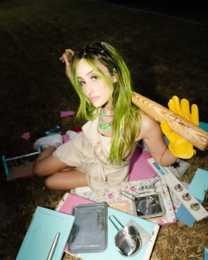 Phem Instagram - Alt.pop upstart phem has released a lyric video for their new single, playing house.

Showing phem gleefully taking a baseball bat to a children’s kitchen toy, the track itself isn’t one of aggression, but much more serene in nature, as the green-haired singer looks ahead to the next part of her life and musical career.

“This song represents a beautiful ending to a chapter I’ve been hoping to close for some time now,” says phem. “I’m not happy, I’m not sad, I’m neutral. Here comes Phase 3.”

Listen now on Kerrang.com.