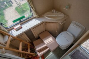Sarah Beeny Instagram - #beforeandafter -  Ok, I know it’s not a tent but I’m starting to see the joy of camping, if you have a comfy bed and lovely bathroom! Loved this project xxx .
 .
#caravan #renovation #sarahbeenynewlife @forthefloorandmore @lite_stone