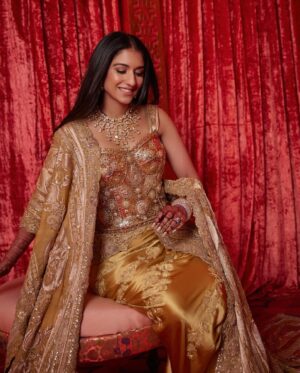 Shereen Sikka Instagram - Radhika Ambani for her Reception in @dolcegabbana Alta Moda Sardegna 2024 and custom @anamikakhanna.in Couture. 
Footwear @aprajitatoorofficial 
Styled with @rheakapoor @sanyakapoor
Glam @bbhiral @loveleen_makeupandhair 
Draped by @dolly.jain 
Style team @meghnadhall @styledbysujata 
@stylebyvanshika 

Pictures by @gregswalesart