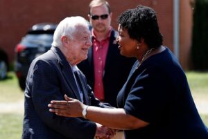 Stacey Abrams Instagram - President Jimmy Carter lived a life of courage, fortitude, kindness and grace. He was a giant who never saw anyone as smaller than himself. Whether at a Boys & Girls Club banquet or when he sponsored a medical clinic for the uninsured in his corner of rural Georgia, he lived James 2:17 each day.

Jimmy Carter built homes, saved lives and tended to souls. God bless President Carter, may the family he and Mrs. Carter raised know only comfort in these days of grief.