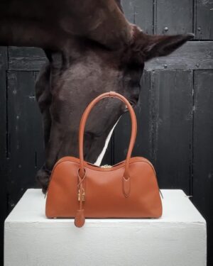 Stella McCartney Instagram - HEALING POWER OF HORSES: The new Ryder bag captured alongside Toto, an equine therapy horse at @OperationCentaur.​

In #equinetherapy, horses are centred as therapists – responding to their human patients with instincts instead of judgments, creating a safe space to uncover feelings.​

Shop the #StellaRyder bag in-store and at stellamccartney.com​

#StellaMcCartney #crueltyfree #vegan #HealingPowerofHorses